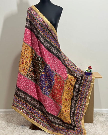 Malai silk dupatta with colorful patchwork and gold border, draped on mannequin