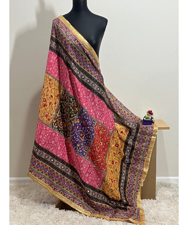 Malai silk dupatta with colorful patchwork and gold border, draped on mannequin