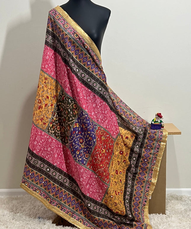 Malai silk dupatta in vibrant patchwork with a gold border, draped over a mannequin.