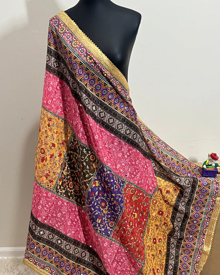 Colorful Malai silk dupatta with patchwork blocks, floral motifs, and gold border draped on a mannequin.