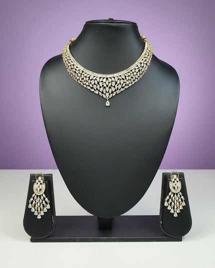 House Of Indian Wedding Attire gold-toned choker necklace with V-shape design and matching drop earrings, adorned with cubic zirconia stones.