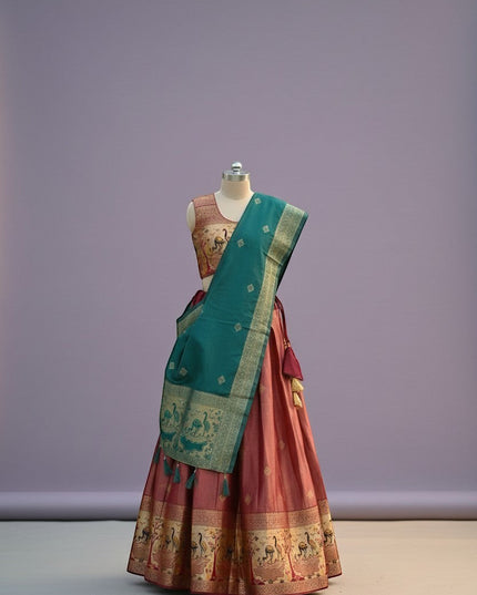 House Of Indian Wedding Attire pink silk lehenga choli with teal dupatta featuring peacock motifs and tassels.