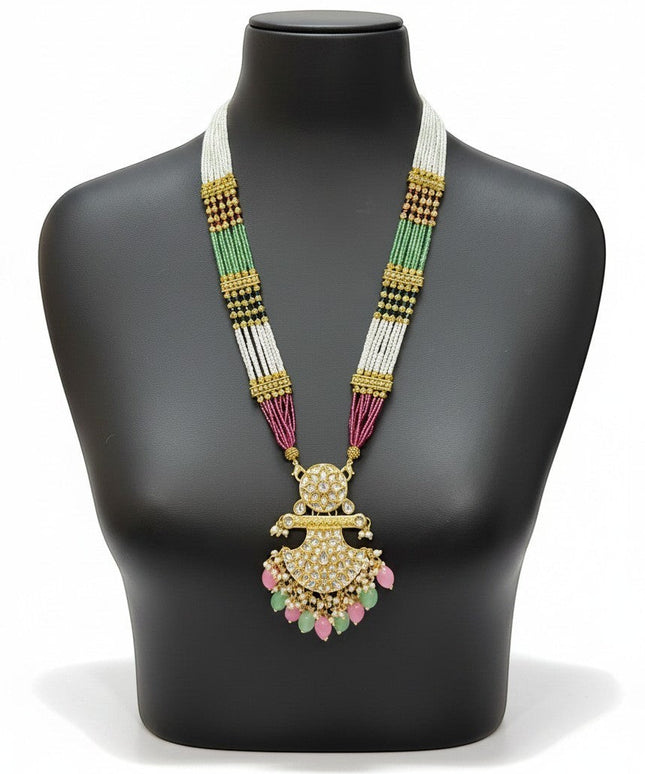 Kurti Connection USA multi-strand beaded necklace with a gold-tone kundan pendant, pearl accents, and teardrop beads.