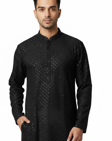 Kurti Connection USA black traditional men's kurta featuring intricate all-over embroidery and a mandarin collar.