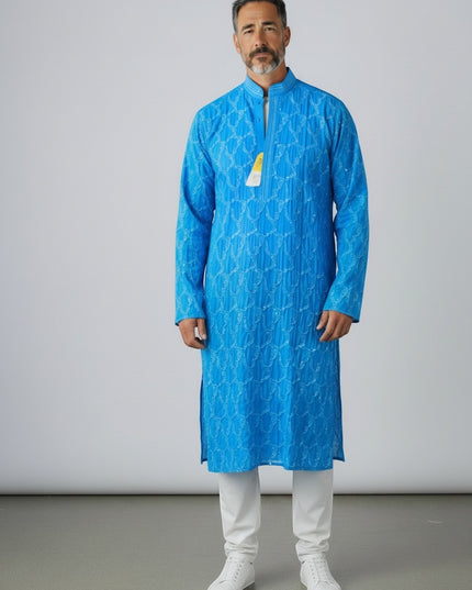 Man wearing a Kurti Connection USA vibrant blue embroidered kurta tunic with a mandarin collar and white trousers.