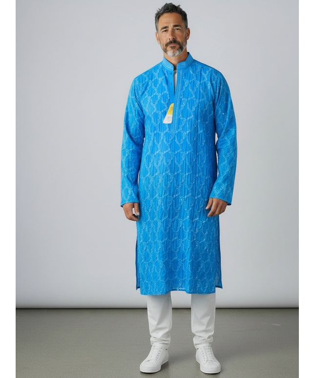 Man wearing a Kurti Connection USA vibrant blue embroidered kurta tunic with a mandarin collar and white trousers.