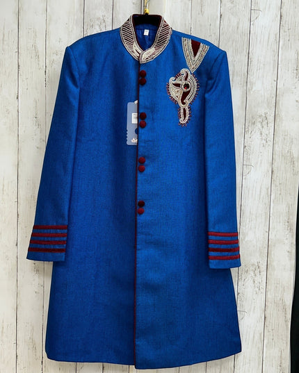 Kurti Connection USA blue sherwani jacket with red velvet accents, mandarin collar, and intricate chest embroidery.