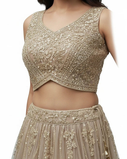 Kurti Connection USA champagne sleeveless crop top and skirt set with intricate floral embroidery and beadwork