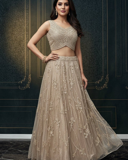 Kurti Connection USA champagne embellished sleeveless crop top and floor-length skirt set with intricate embroidery