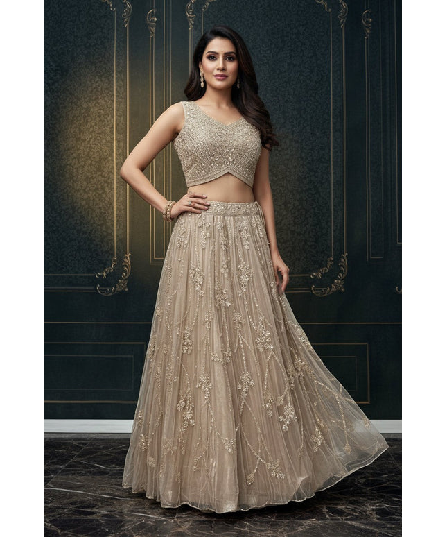 Kurti Connection USA champagne embellished sleeveless crop top and floor-length skirt set with intricate embroidery