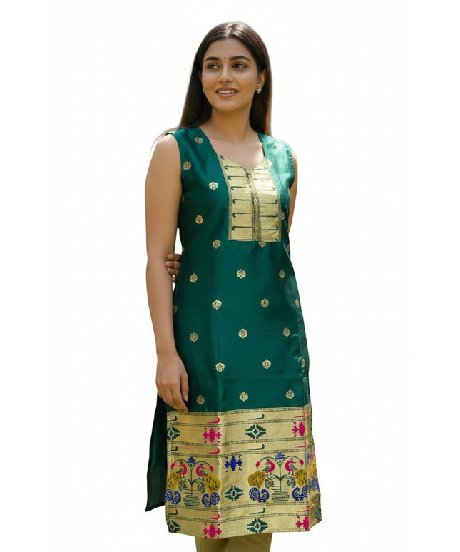 Kurti Connection USA emerald green silk sleeveless kurta with gold zari motifs, embellished neckline, and peacock border. Model is wearing it for a festive occasion.