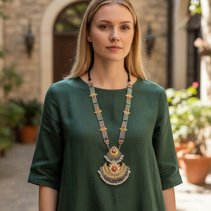 Kurti Connection USA traditional ethnic statement necklace with oxidized silver, gold accents, red stones, and pearls.