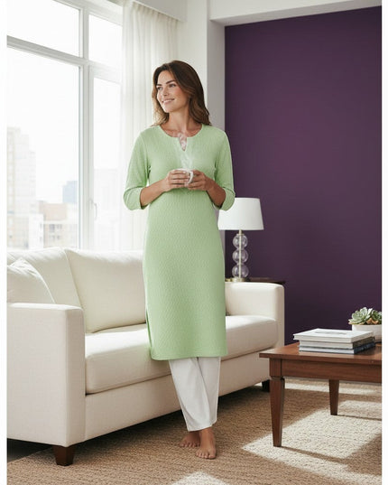 Kurti Connection USA light green textured cotton kurti with 3/4 sleeves and white trousers.
