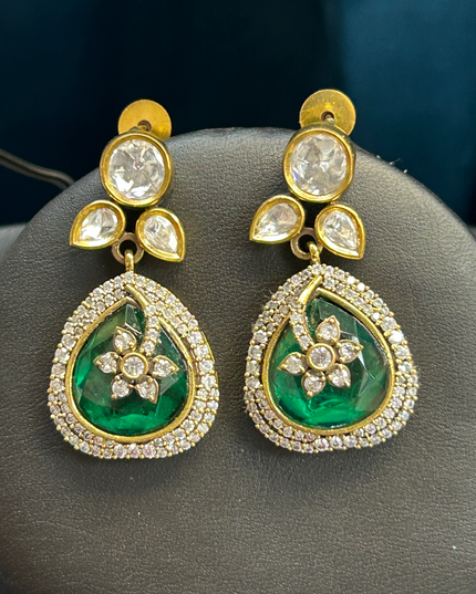 Kurti Connection USA elegant teardrop earrings featuring deep green stones, floral motifs, and white crystal halos.