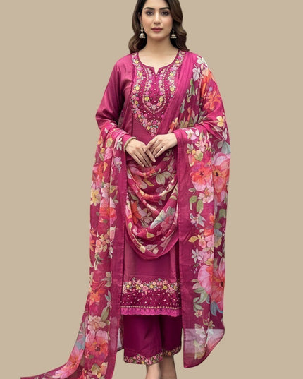 Model wearing a Kurti Connection USA magenta kurti set with floral embroidery and a matching floral print dupatta.