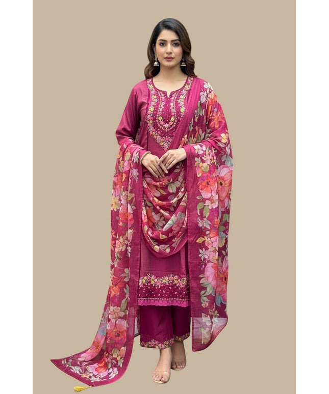 Model wearing a Kurti Connection USA magenta kurti set with floral embroidery and a matching floral print dupatta.
