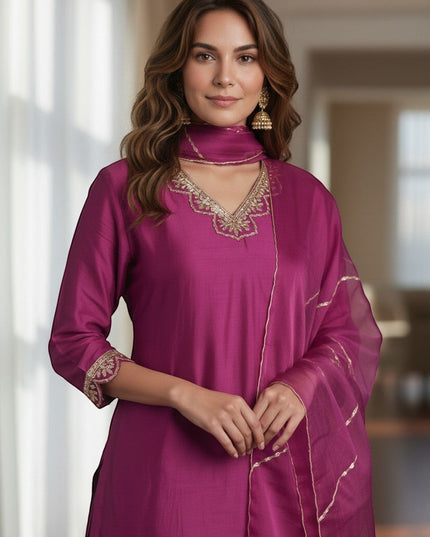 Kurti Connection USA magenta silk sharara suit with gold embroidery on neckline and cuffs. Sheer dupatta with gold trim.