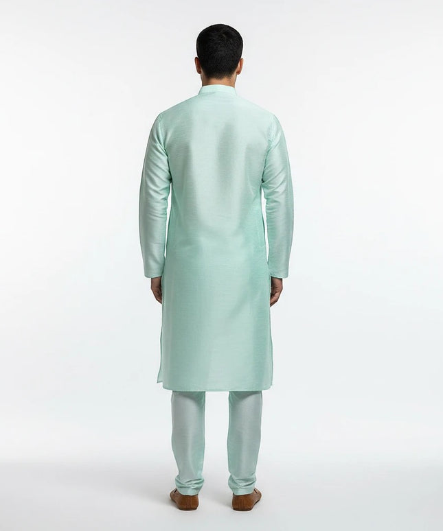 Back view of a man wearing a Kurti Connection USA mint green traditional kurta pajama set with a mandarin collar.