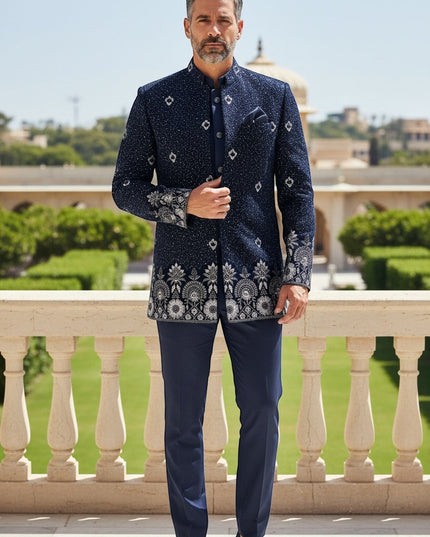 Kurti Connection USA navy blue embroidered Bandhgala suit with silver detailing on collar, cuffs, and hem. Tailored fit.