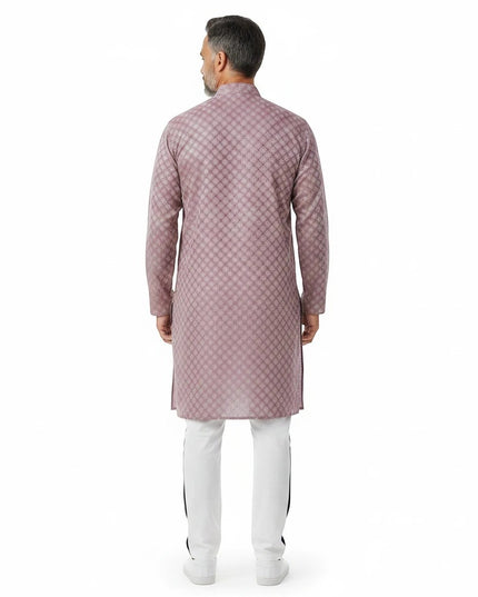 Man wearing a Kurti Connection USA onion pink patterned kurta with white trousers, back view