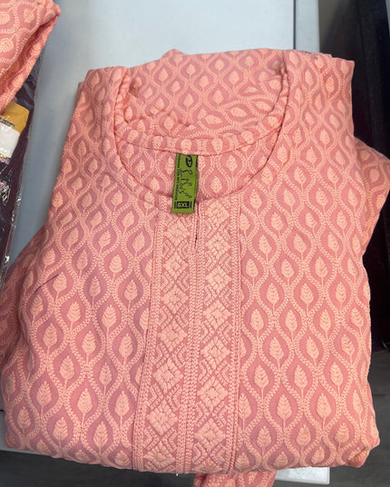 Kurti Connection USA peach kurti top with all-over leaf embroidery and textured front panel. Relaxed fit, round neckline.