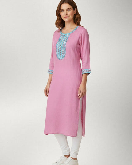 Kurti Connection USA pink kurti tunic with intricate blue embroidery on the neckline and cuffs worn with white leggings