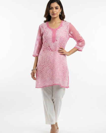 Kurti Connection USA pink kurti tunic with intricate white floral embroidery, scoop neckline, and three-quarter sleeves.