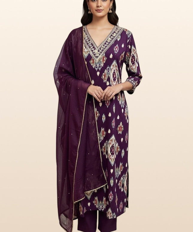 Model wearing a Kurti Connection USA purple ikat-print kurti set with V-neck embroidery and a sheer matching dupatta.