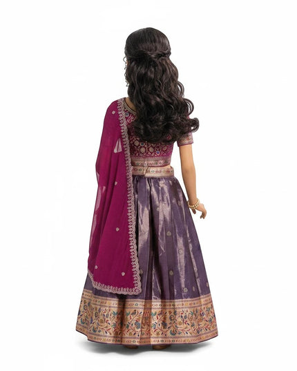 Back view of a girl wearing a purple Kurti Connection USA pattu lehenga with intricate gold border and matching dupatta