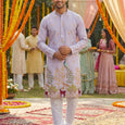 Kurti Connection USA light purple silk kurta set with intricate embroidery of peacocks and deer, paired with white pajama.