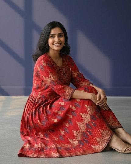 Kurti Connection USA red Anarkali kurti with gold and navy blue prints, detailed yoke, and flowing flare.