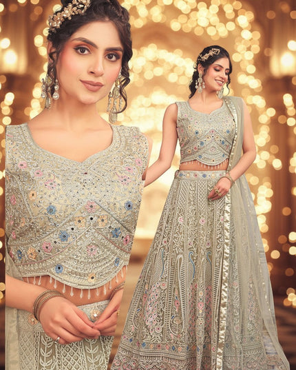 Kurti Connection USA sage lehenga choli with multi-colored floral embroidery, mirror work, and scalloped beaded hem.