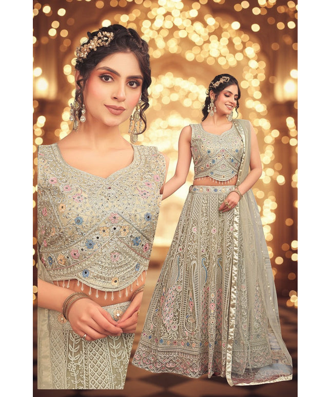Kurti Connection USA sage lehenga choli with multi-colored floral embroidery, mirror work, and scalloped beaded hem.