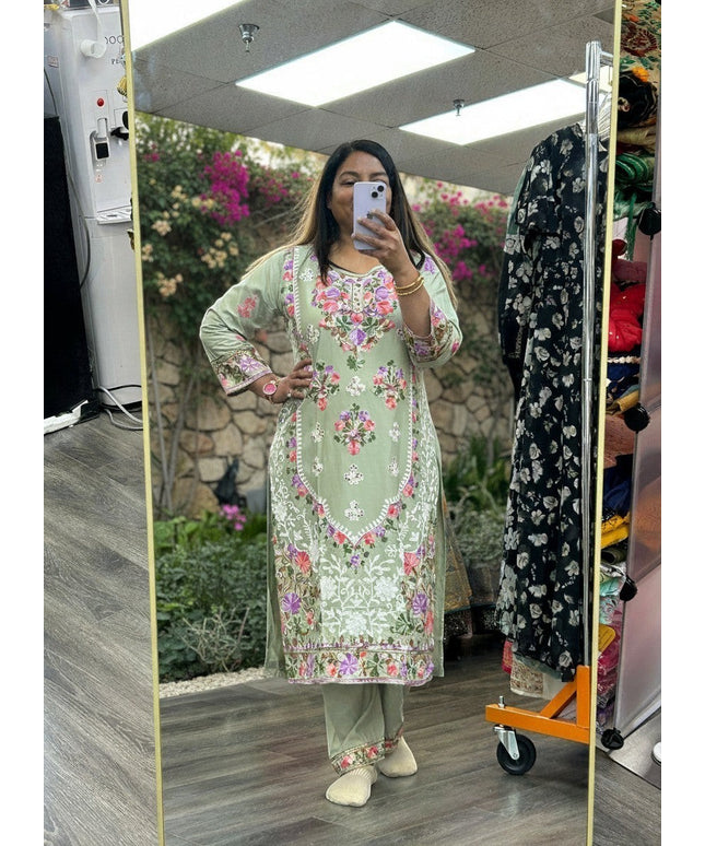 Kurti Connection USA sage green kurti set with multi-colored floral embroidery, round neck, and matching trousers.