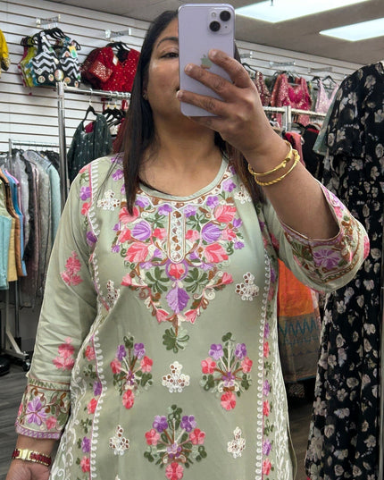 Kurti Connection USA sage green kurti with intricate multi-colored floral embroidery, round neck, and 3/4 sleeves.