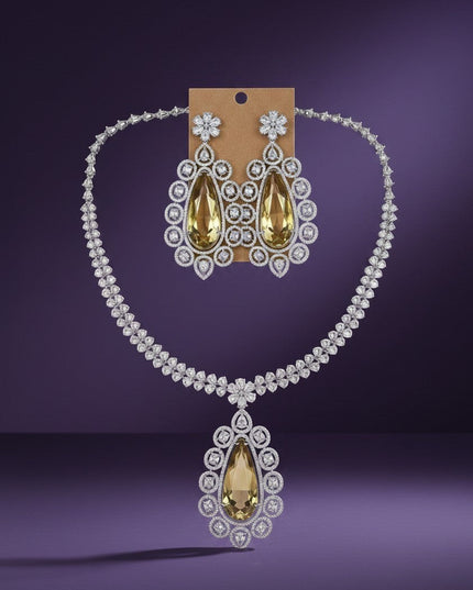 Kurti Connection USA statement necklace and earrings set with large pear-shaped yellow gemstones and clear crystals.