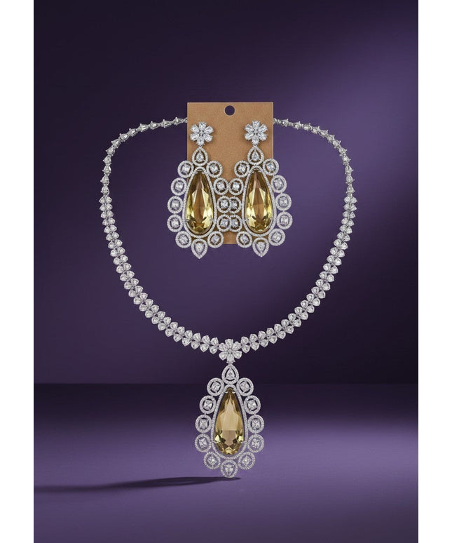 Kurti Connection USA statement necklace and earrings set with large pear-shaped yellow gemstones and clear crystals.