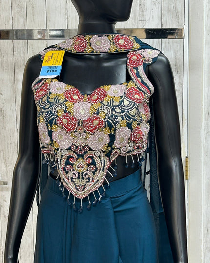 Kurti Connection USA teal crop top with intricate floral embroidery, beadwork, and fringe on a black mannequin
