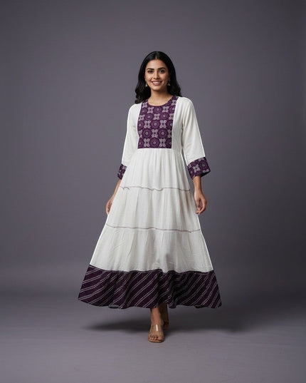 Kurti Connection USA white tiered maxi dress with purple embroidered yoke and cuffs, flowing silhouette.