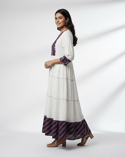 Kurti Connection USA white tiered maxi dress with embroidered purple yoke and cuffs, 3/4 sleeves, and patterned hem.