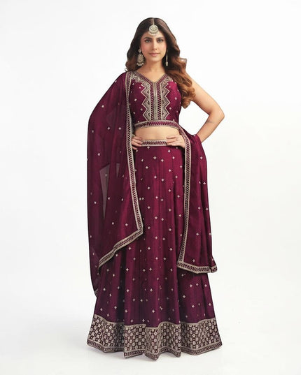 Kurti Connection USA wine sleeveless lehenga choli with silver embroidery and matching dupatta on a model