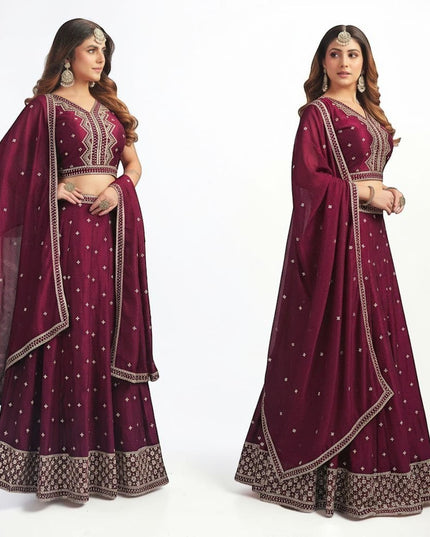 Kurti Connection USA wine sleeveless lehenga choli with silver embroidery, flared skirt, and matching dupatta.