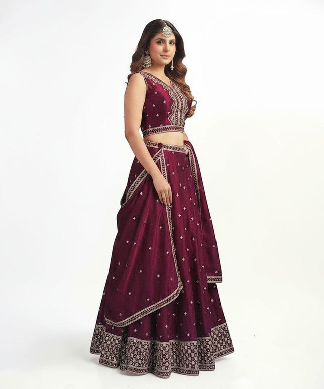 Kurti Connection USA wine sleeveless lehenga choli with silver embroidery, flared skirt, and matching dupatta.